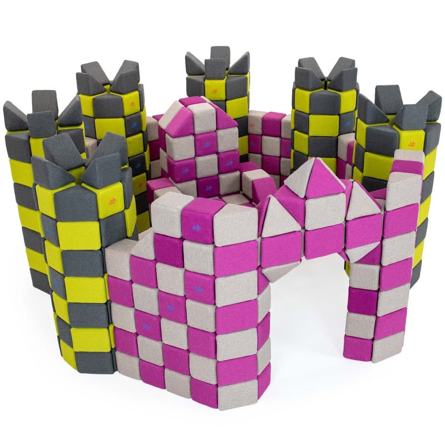A castle with towers and a gate built from pink, grey and yellow JollyHeap blocks